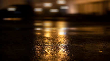 Dark street wet asphalt reflections of rays in the water Abstract dark blue background smoke smog Empty dark scene neon light spotlightsの写真素材