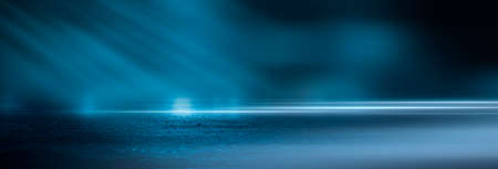 Dark street wet asphalt reflections of rays in the water Abstract dark blue background smoke smog Empty dark scene neon light spotlightsの写真素材