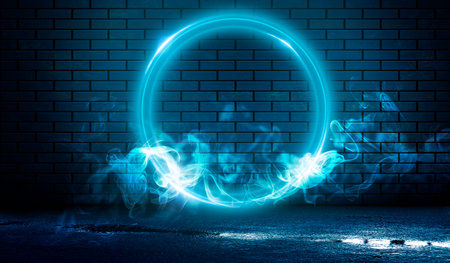 Dark brick wall, blue neon light. Rays and glare of light in the dark. Night view of a dark street, abstract projection on an empty wall. Dark background of empty street, night city.の写真素材