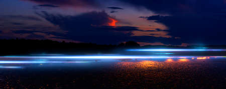 Dark street reflection on wet asphalt, fog, night city. Rays of neon light in the dark, neon light,...