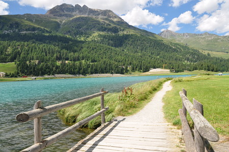 Beautiful scenery of wooden bridge in a peaceful mountain areaの写真素材