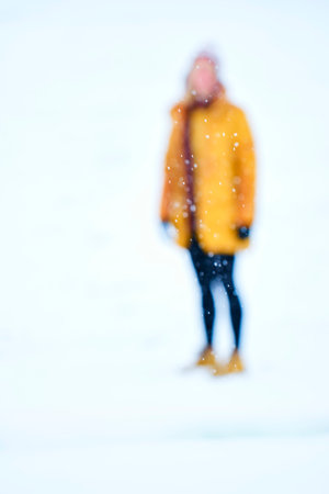 Woman silhouette in snow outdoor.の写真素材
