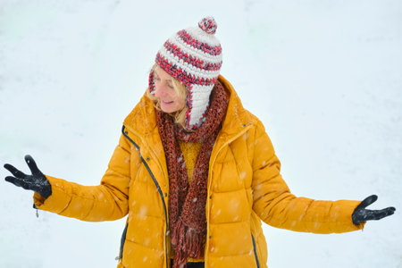 Young woman enjoying snow outdoor.の写真素材