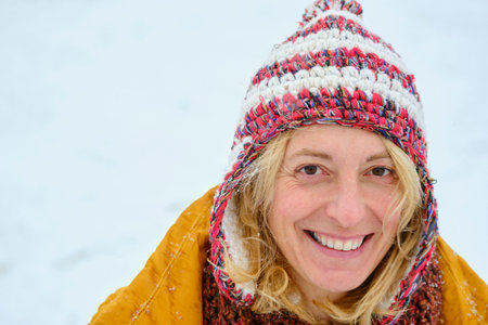 Young woman enjoying snow outdoor.の写真素材