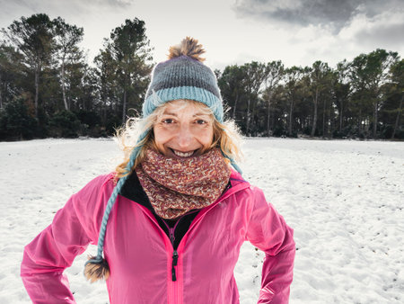 Young woman enjoying snow outdoor.の写真素材