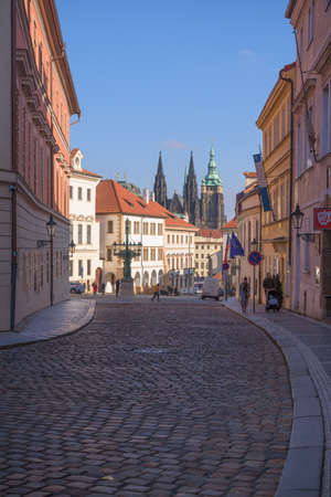View of Prague castle and Saint Vitus Cathedral with street and buildingsのeditorial素材