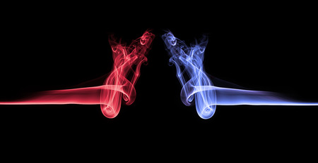 Blue smoke vs red smoke abstractの写真素材