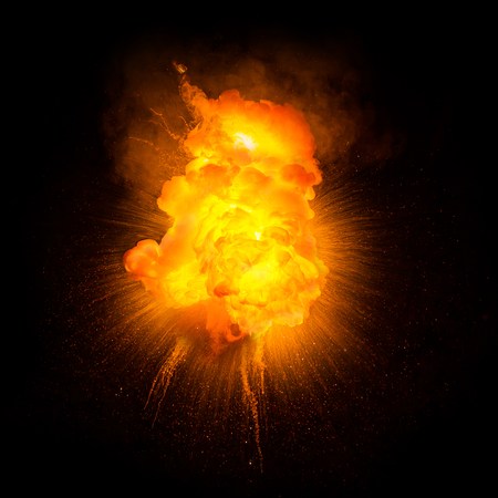 Realistic fiery explosion with sparks over a black backgroundの写真素材