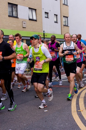 LONDON - APRIL 22  Unidentified men run the London marathon on April 22, 2012 in London, England, UK  The marathon is an annual event のeditorial素材