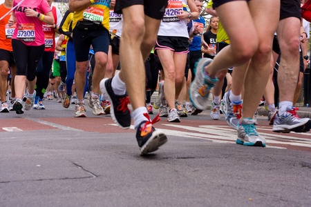 LONDON - APRIL 22: Unidentified people run the London marathon on April 22, 2012 in London, England, UK. The marathon is an annual event.のeditorial素材