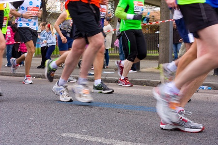 LONDON - APRIL 22: Unidentified people run the London marathon on April 22, 2012 in London, England, UK. The marathon is an annual event.のeditorial素材
