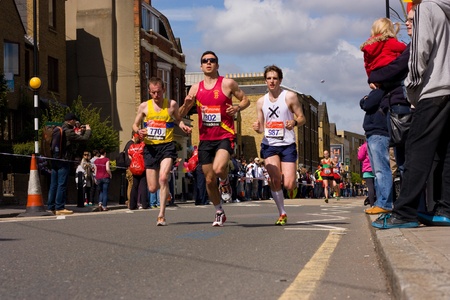 LONDON - APRIL 22: Unidentified people run the London marathon on April 22, 2012 in London, England,...
