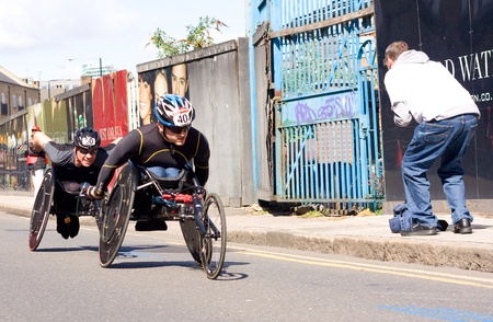 LONDON - APRIL 22: Unidentified wheelchair racers at the London marathon on April 22, 2012 in...