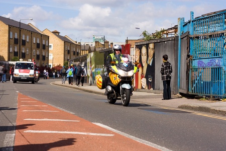 LONDON - APRIL 22: security patrol in front of the lead car during the London marathon on April 22,...