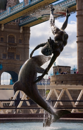 statue by tower bridge, london.の写真素材