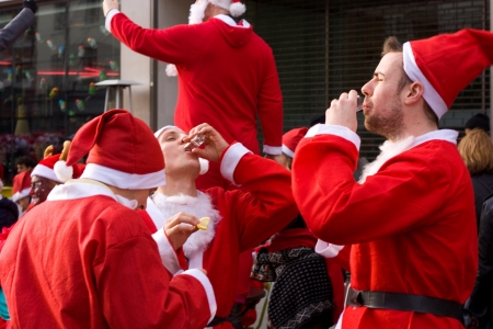 LONDON-DEC 15: Unidentified santa's in the street at the Santacon street festival in London,...