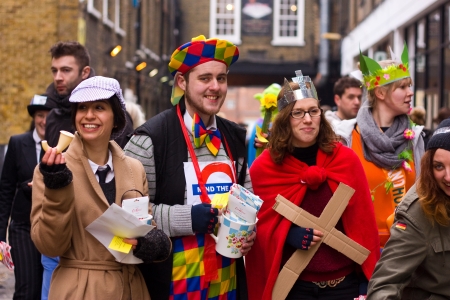 LONDON - FEBRUARY 12TH: Unidentified competitors at the Great spitalfield pancake race on the 12th of February 2013 in london, UK.  The Great Spitalfield pancake race raised money for the Londonのeditorial素材