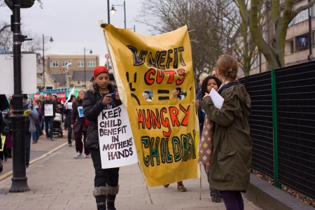 LONDON - APRIL 13TH: Unidentified people protest at the Thousand Mothers March for Benefit Justice in Tottenham, London on April the 13th 2013.  The "bedroom tax" effects the working class people.のeditorial素材