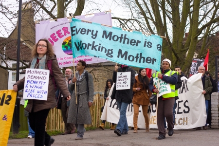 LONDON - APRIL 13TH: Unidentified people protest at the Thousand Mothers March for Benefit Justice in Tottenham, London on April the 13th 2013.  The "bedroom tax" effects the working class people.のeditorial素材