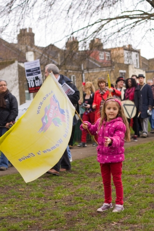 LONDON - APRIL 13TH: Unidentified people protest at the Thousand Mothers March for Benefit Justice in Tottenham, London on April the 13th 2013.  The "bedroom tax" effects the working class people.のeditorial素材