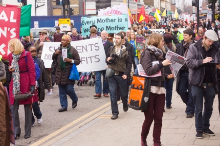 LONDON - APRIL 13TH: Unidentified people protest at the Thousand Mothers March for Benefit Justice in Tottenham, London on April the 13th 2013.  The "bedroom tax" effects the working class people.のeditorial素材