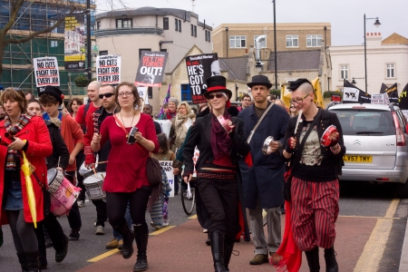 LONDON - APRIL 13TH: Unidentified people protest at the Thousand Mothers March for Benefit Justice in Tottenham, London on April the 13th 2013.  The "bedroom tax" effects the working class people.のeditorial素材