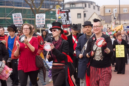 LONDON - APRIL 13TH: Unidentified people protest at the Thousand Mothers March for Benefit Justice in Tottenham, London on April the 13th 2013.  The "bedroom tax" effects the working class people.のeditorial素材