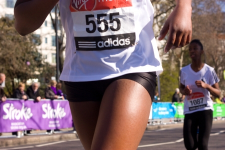 LONDON - APRIL 13: Unidentified girls run the London marathon on April 13th, 2013 in London, England, UK. The marathon is an annual event. のeditorial素材