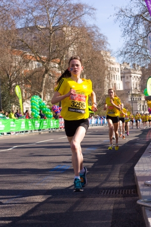LONDON - APRIL 13: Unidentified girls run the London marathon on April 13th, 2013 in London, England, UK. The marathon is an annual event. のeditorial素材