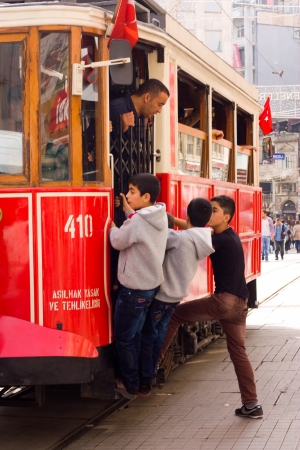 ISTANBUL, TURKEY - OCT 16TH 2013: A red heritage tram on the 16th of October 2013 in Istanbul, Turkey. The heritage tram was opened in 1990.のeditorial素材