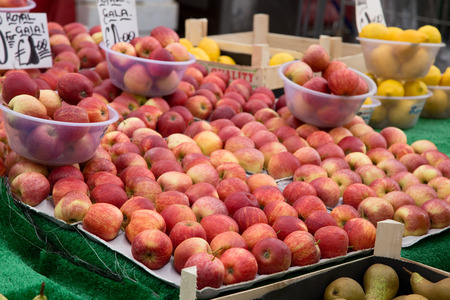 Royal Gala apples at a market stall.の写真素材