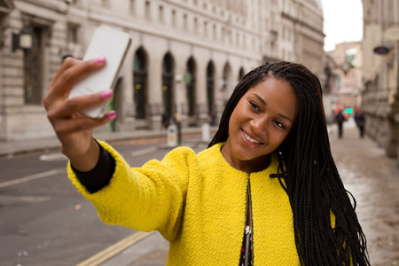 young woman taking a selfie.の写真素材
