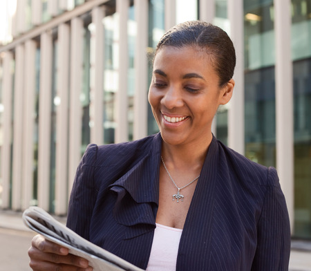 business woman reading the newspaper.の写真素材