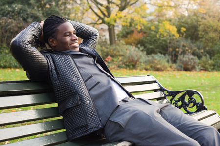 young business man relaxing in the parkの写真素材