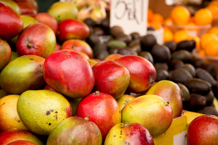 fresh mango's at a marketの写真素材