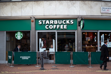 LONDON - DECEMBER 11TH: The exterior of a starbucks coffee shop on December the 11th, 2014, in London, England, UK. Starbucks has 15000 stores worldwide.のeditorial素材