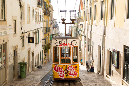 LISBON - JANUARY 9TH: An old traditional tram on January the 9th, 2015, in Lisbon, Portugal. Lisbon's number 28 tram is one of the city's cultural attractions.のeditorial素材