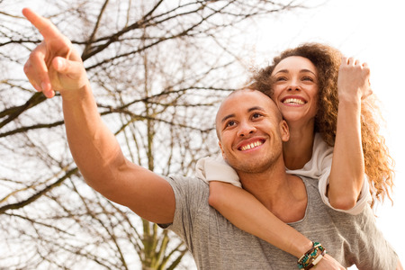 young man carrying his girlfriendの写真素材