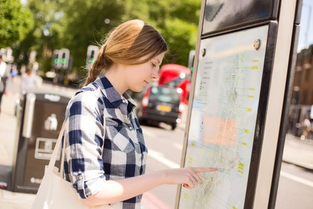 young woman reading a map