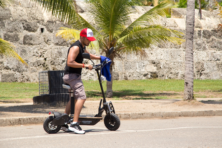 CARTAGENA - SEPTEMBER 13TH: Unidentified man using an electric scooter on September the 13th, 2015 in Cartagena, Colombia. Cartagena is the 5th largest city in Colombiaのeditorial素材