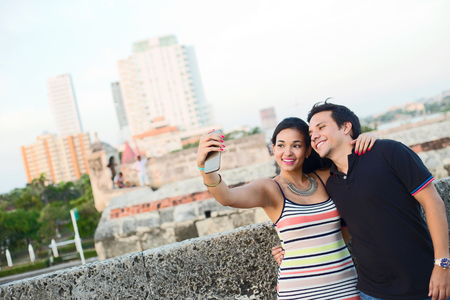 couple taking a selfie in Cartagena, Colombia.の写真素材