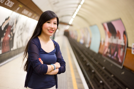 Japanese womon the london underground. an waiting for a trainの写真素材