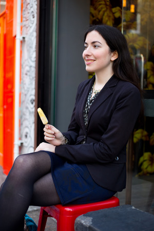 young woman enjoying an ice creamの写真素材