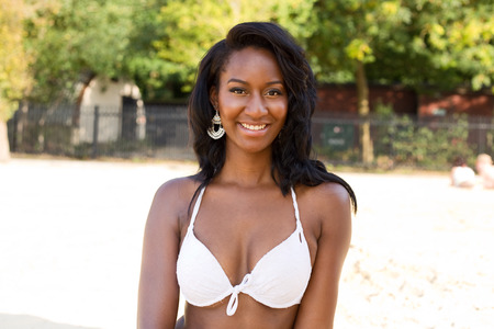 happy girl at the beach in her bikiniの写真素材