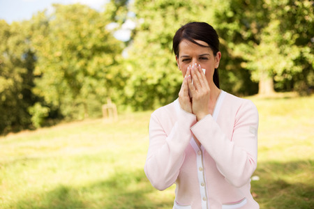 young woman suffering from hay feverの写真素材