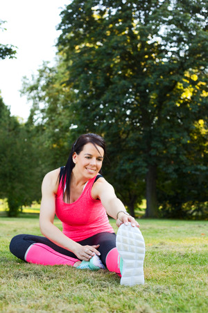 young woman exercising in the parkの写真素材