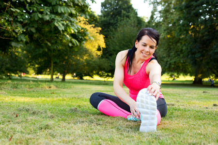 young woman exercising in the parkの写真素材