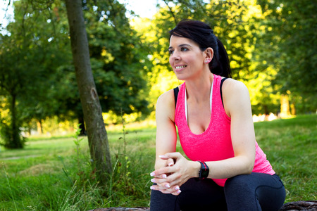 fitness girl sitting in the parkの写真素材