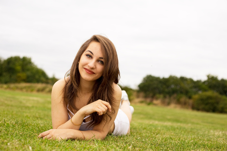 young woman enjoying a day in the parkの写真素材