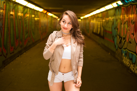 sexy girl wearing a crop top and hot pantsの写真素材